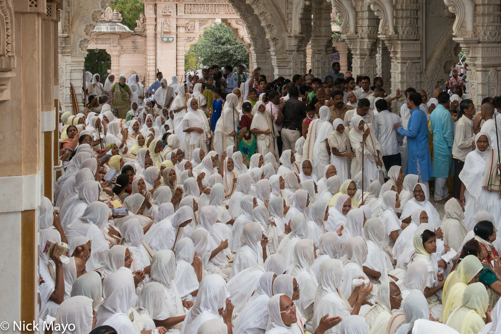 Jain nuns gathered in the temple at the foot of Shatrunjaya Hill at Palitana.