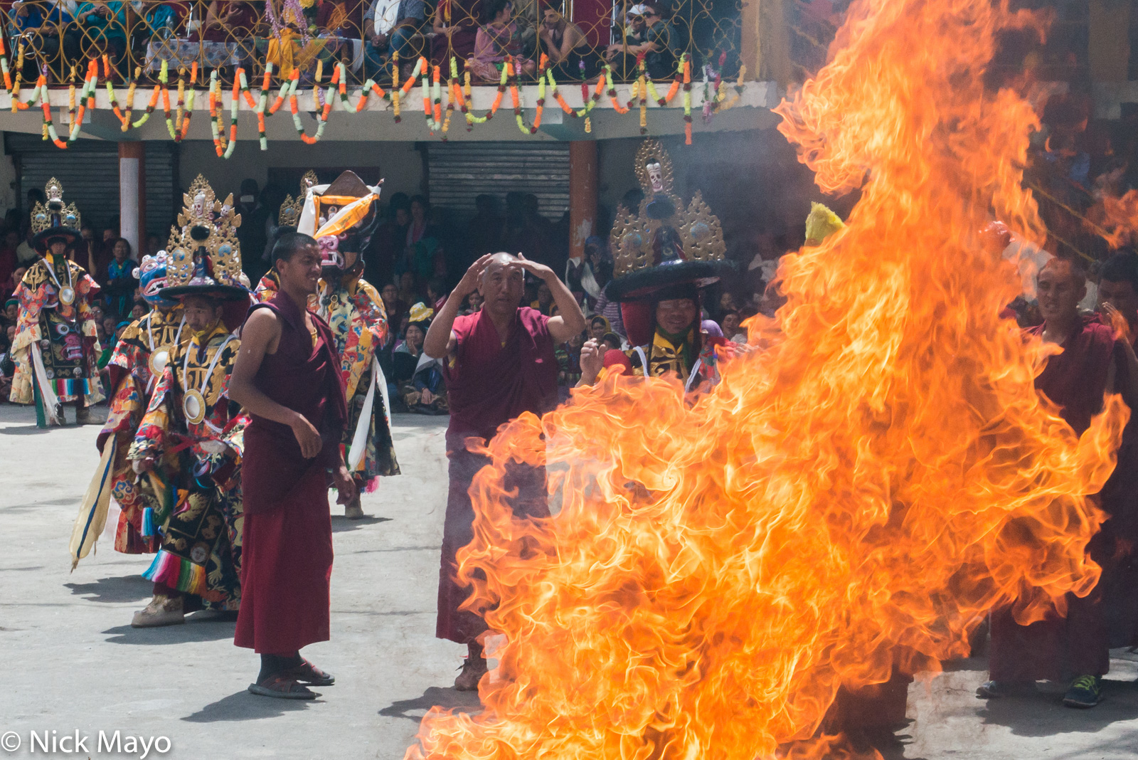 Monks performing a ritual at the sacred fire during the annual festival at the monastery at Ki.