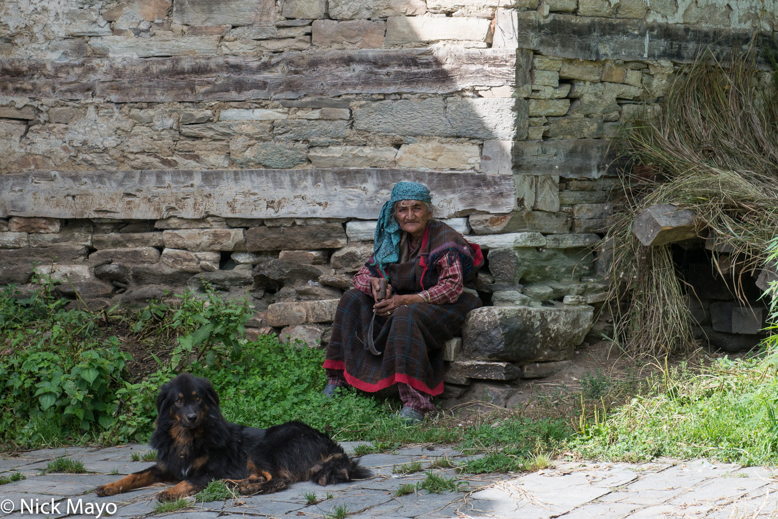 A Bahu village woman with her dog.