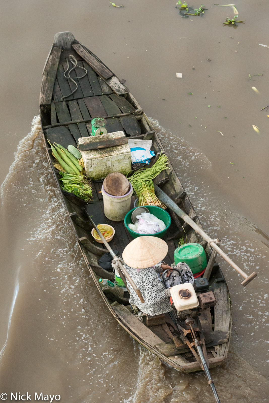 A boat on its way to the floating market at Nga Nam in the Mekong Delta.