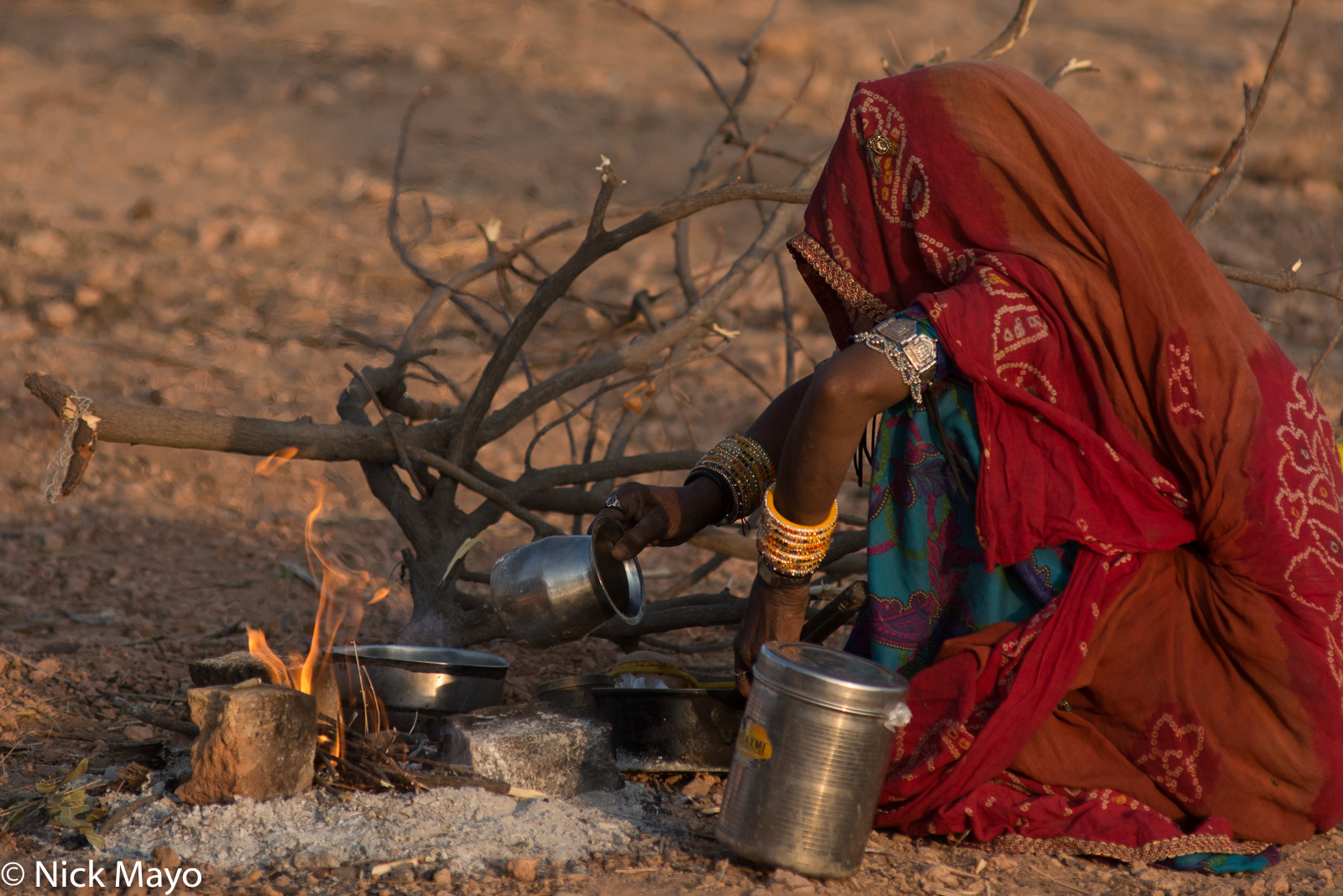 A Merasi woman cooking dinner during the cattle fair at Nagaur.