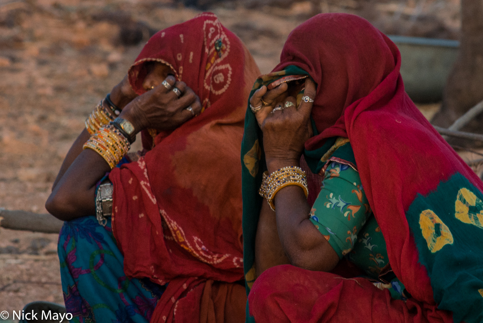 Two Merasi woman wearing traditional bangles and rings at the Nagaur cattle fair.