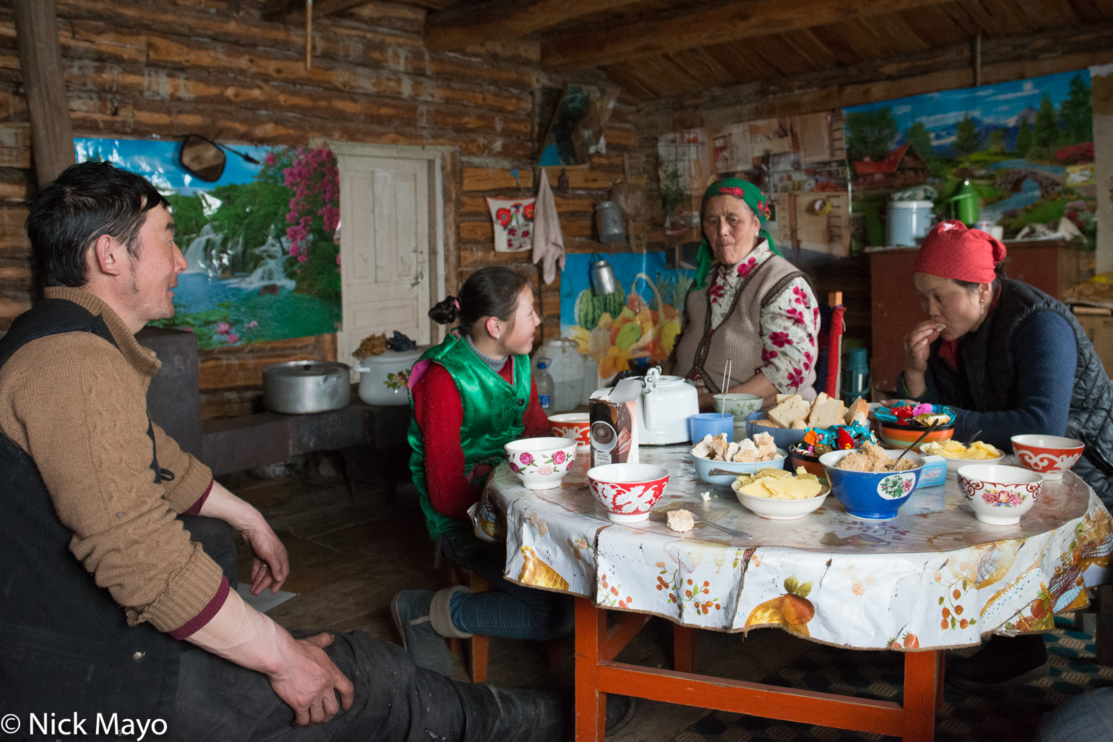 A kettle of tea, bread and cheese are an afternoon meal break for a Kazakh family in Sagsai sum.