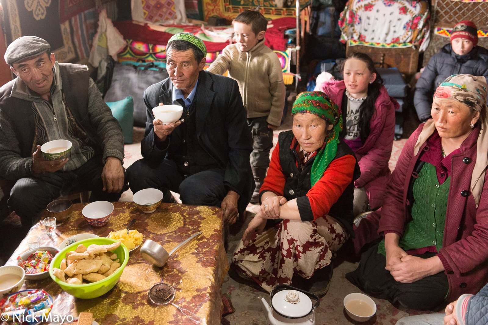 A Kazakh family of Sagsai sum drinking tea.