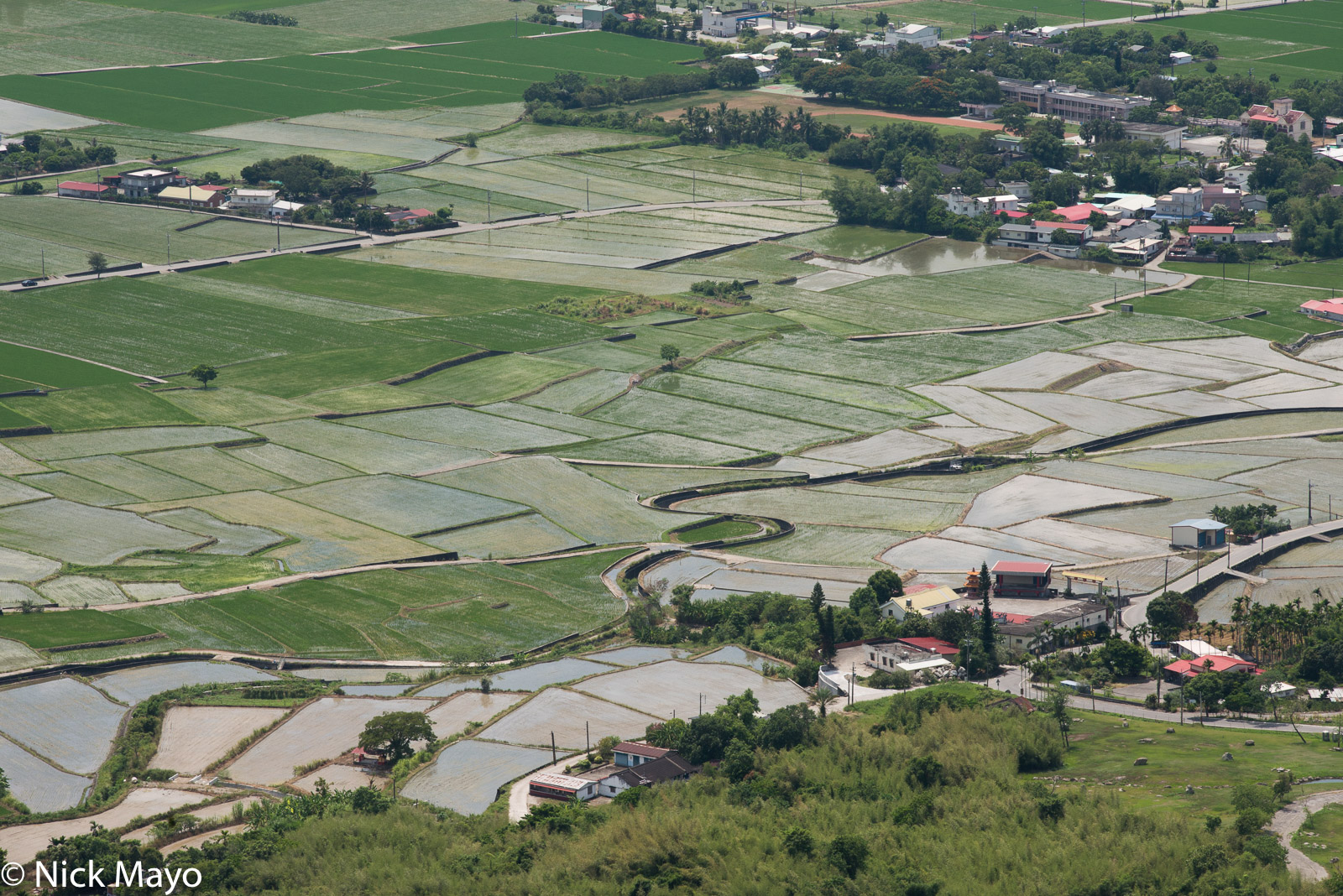 A school and village amongst the paddy fields as viewed from Liushidanshan.