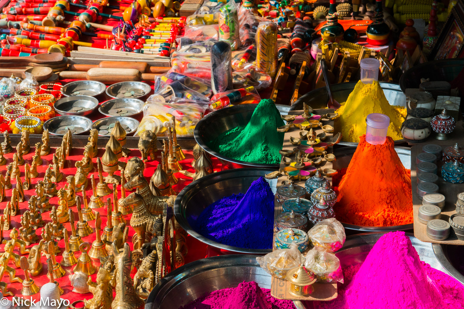 Kumkum powder, religious ornaments and toys on sale in a bazaar shop at Orchaa.