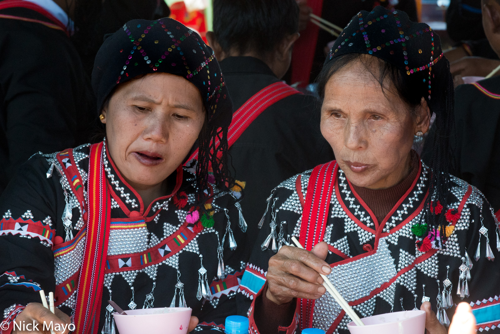 Two Black Lahu women lunching at their New Year festival in Kengtung.