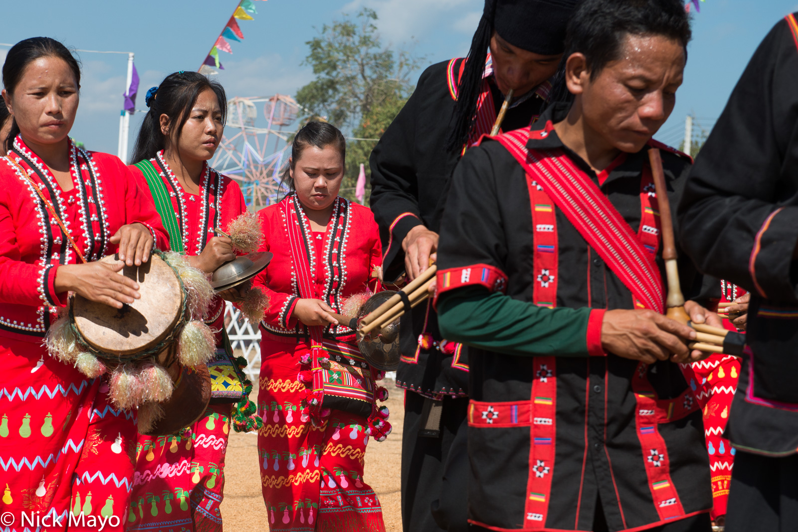 Lahu Na musicians, playing variously pipes, a drum and cymbals, at their New Year festival in Ba Bi.