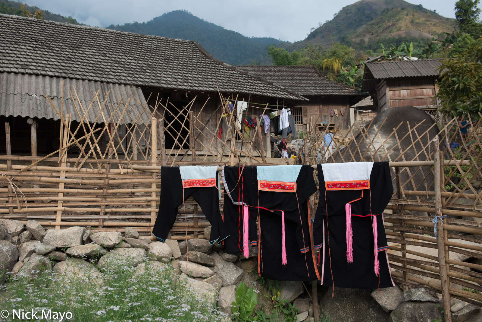 Clothes hung on a fence to dry in the Black Dao village of Pocha.