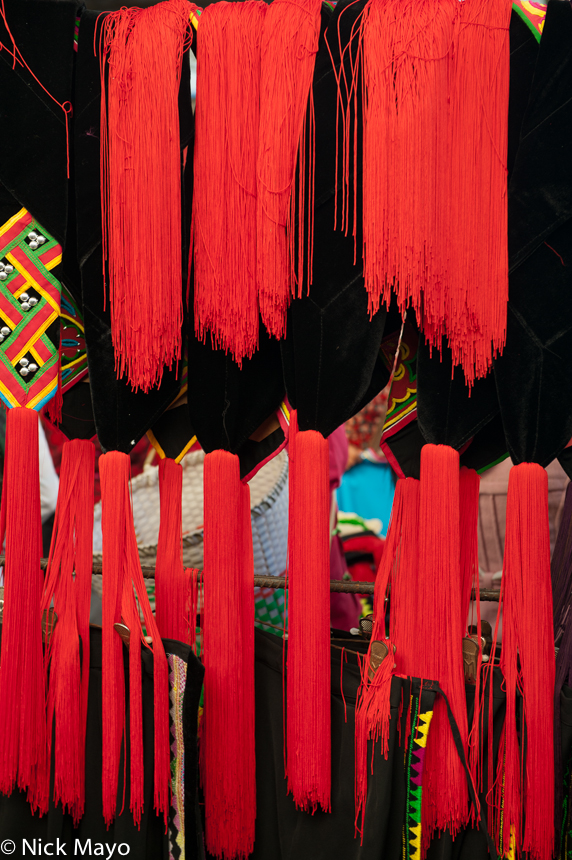 Red hat tassles on sale at Da Hei Shan market.