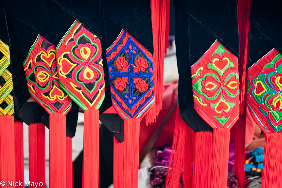 Red hat tassels on sale at a stall in Da Hei Shan market.