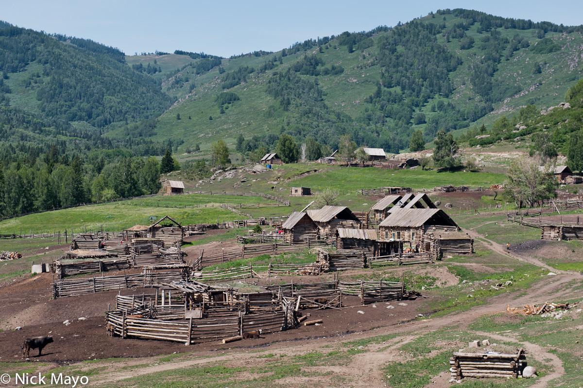 Log cabins and animal pens in a Tuva hamlet near Hemu.