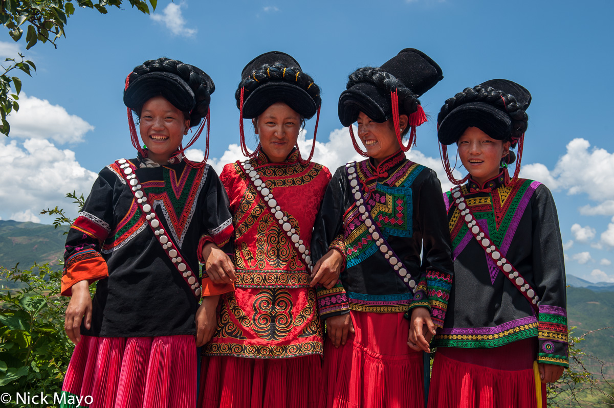 Four unmarried girls at a Yi funeral at Mi Shi Qing Mo in Daliangshan.