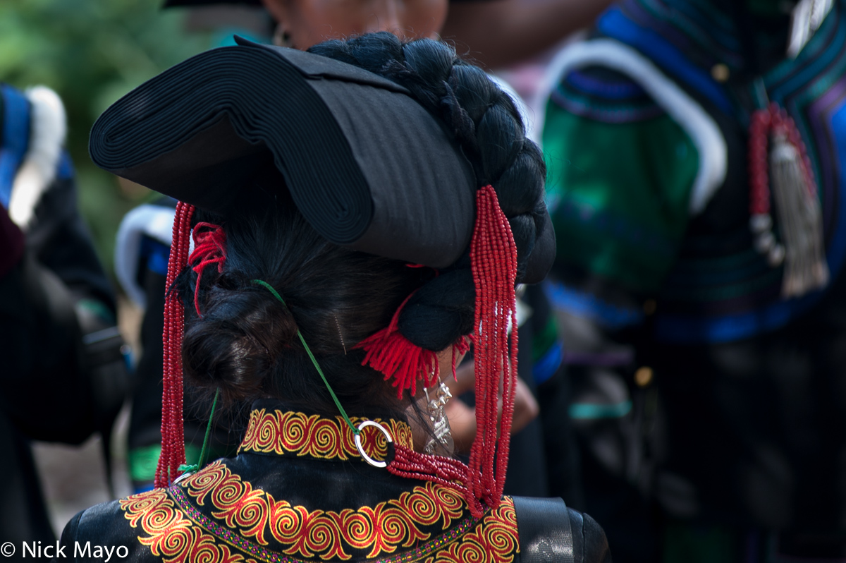 The hat of a Yi woman seen from the reverse at a festival in the Daliangshan village of Hubo Luo.