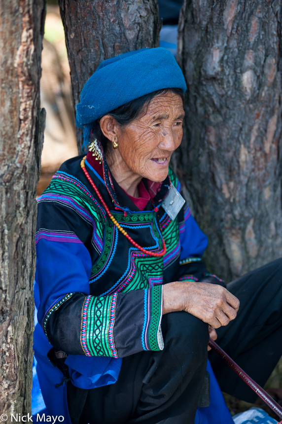 An older Yi lady in traditional clothes at Anha in Daliangshan.