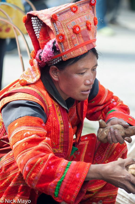 A Yi woman from the Xibeile area shopping at Mengzi market.