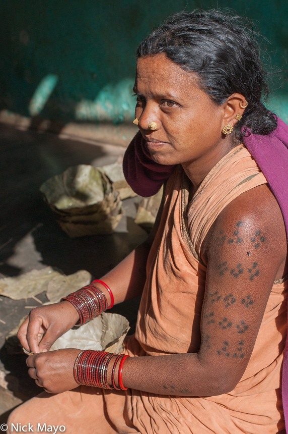 A tattooed Botra woman of the Gond ethnicity in the village of Pajil.