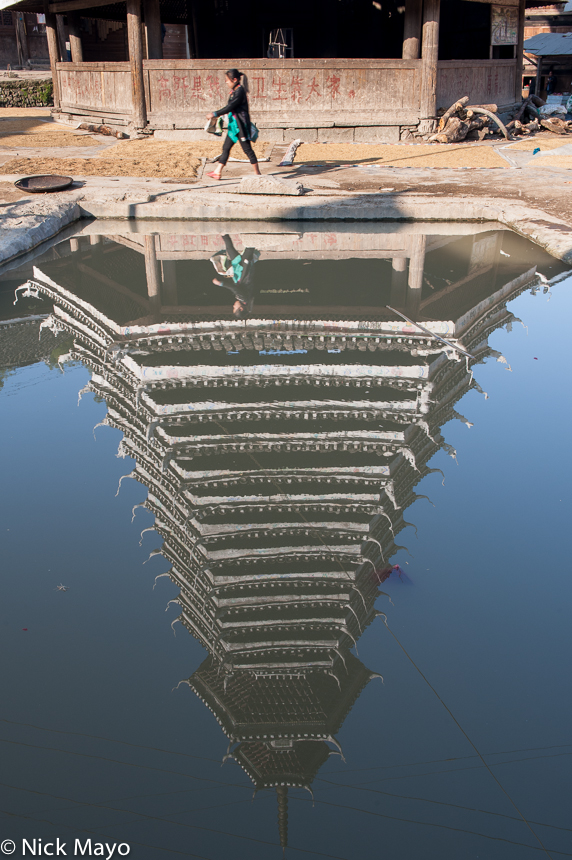 The drum tower in Gaochien reflected in the village pond.