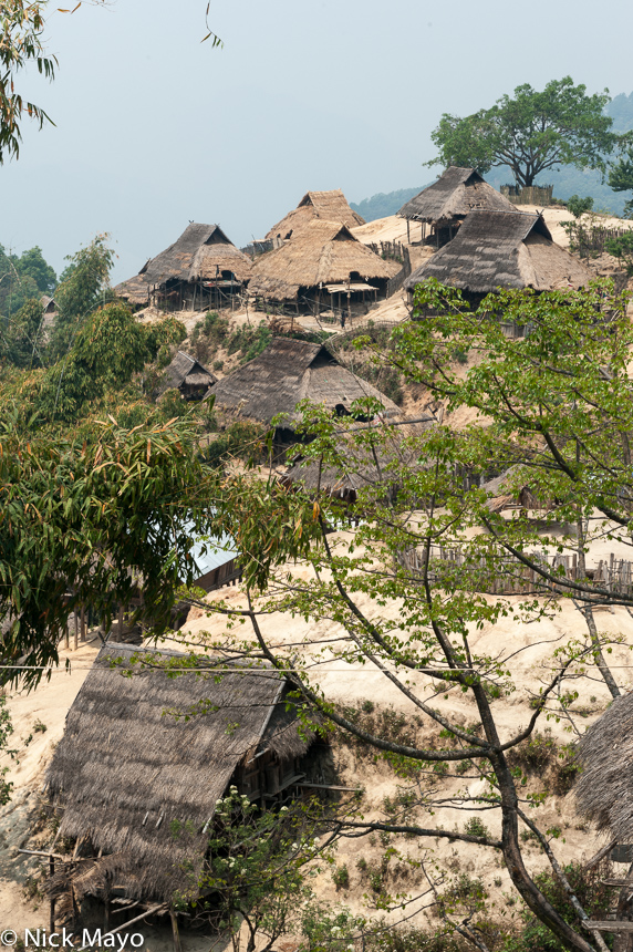 Thatched houses in the hillside Eng village of Ban Nong.