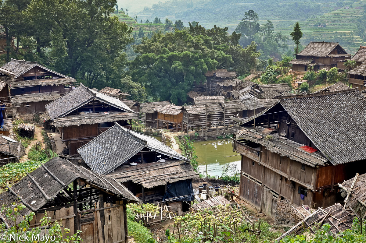 The wooden Dong village of Wuei built around a central pond.