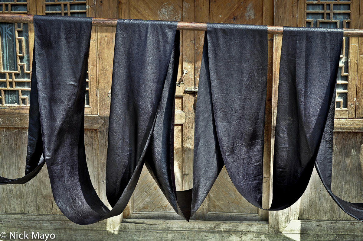 Indigo dyed cloth drying in the Dong village of Yintan.