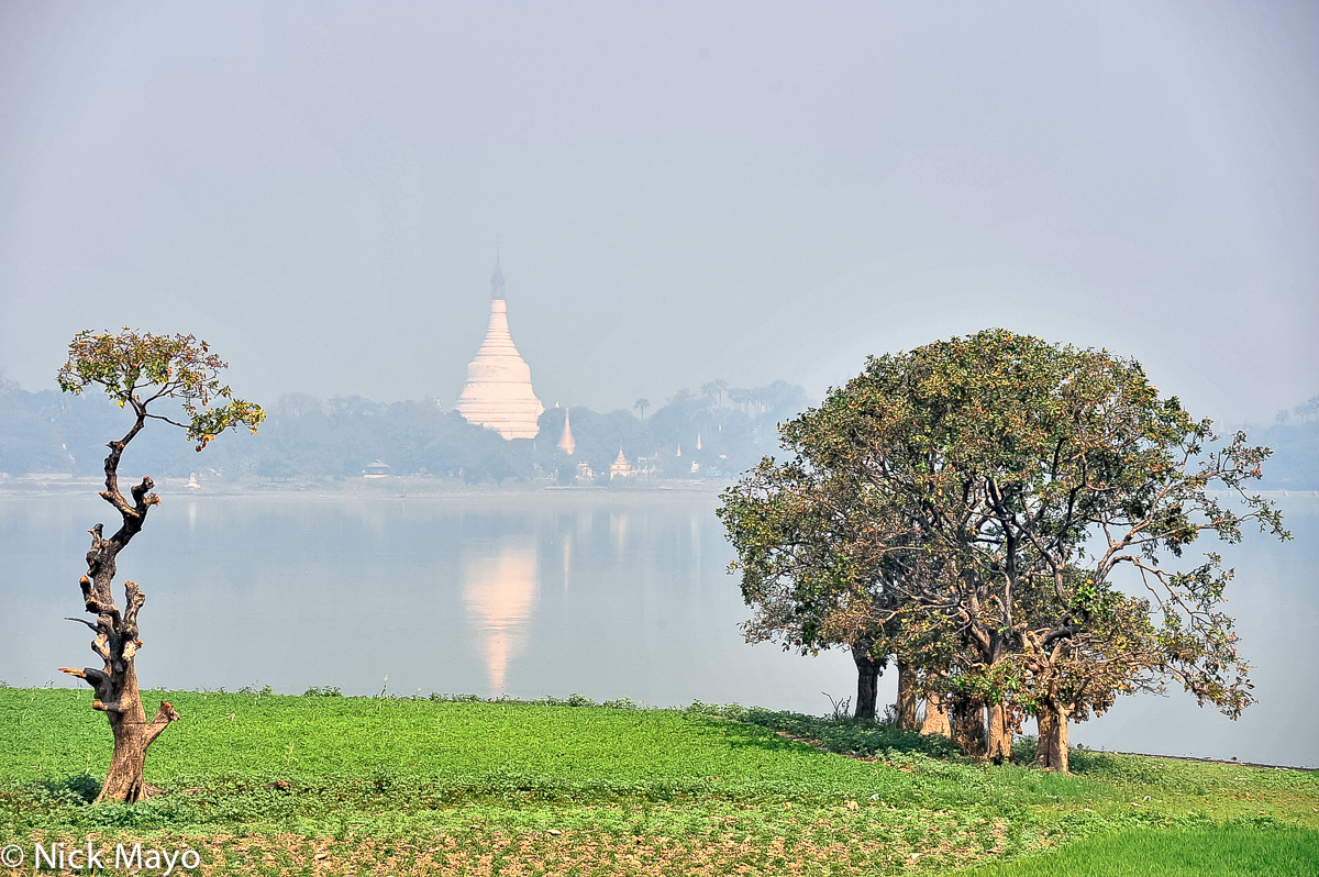 Heat haze shrouding a white stupa in the 19th century Burmese capital of Amarapura.