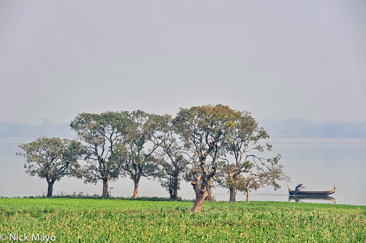 A boat being rowed on Taungthaman Lake at Amarapura.