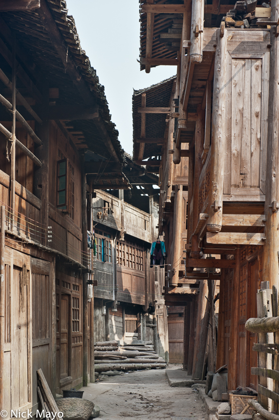 A street lined with wooden residences in the Dong village of Zhenzhong.