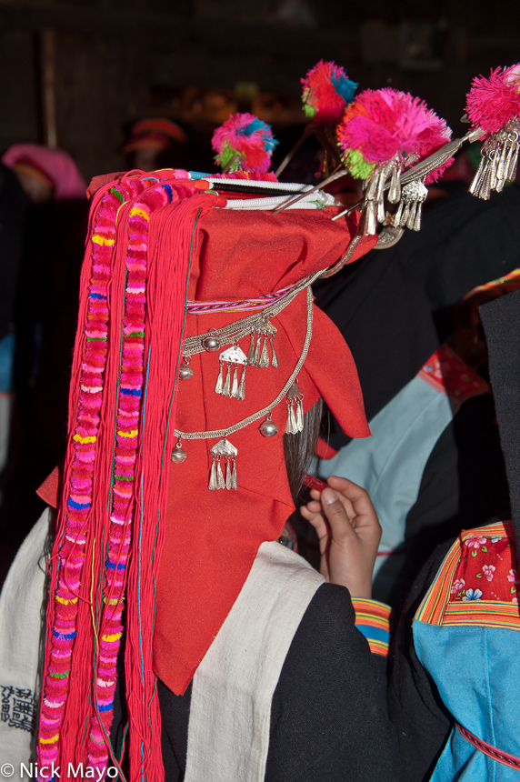 A traditional wedding hat worn by a bridesmaid at a Yao wedding in Hui Yang Yao Zai.