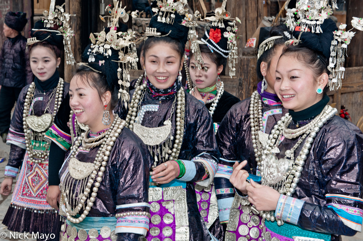 A group of Dong girls in festival attire in Xiaohuang.