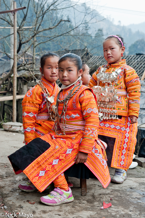 Young Miao girls from Cenzui in wedding attire.