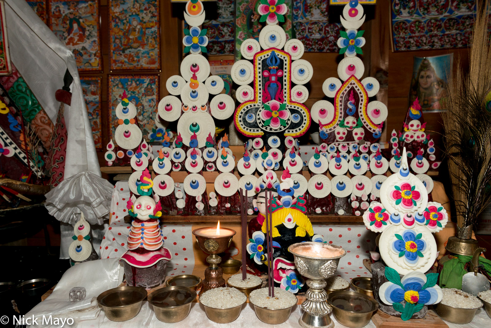 Buddhist butter sculptures ("tormas") on a household shrine in Mechukha.