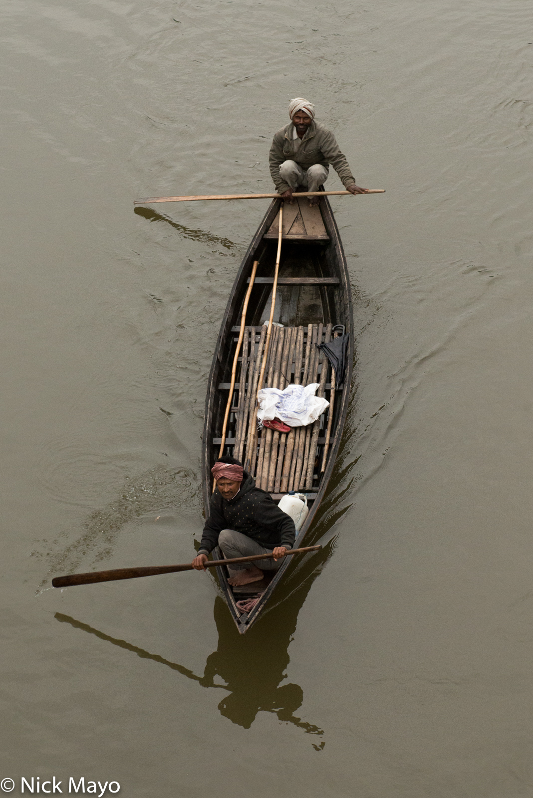 A boat being paddled on the Siyon river near the village of Kabu.