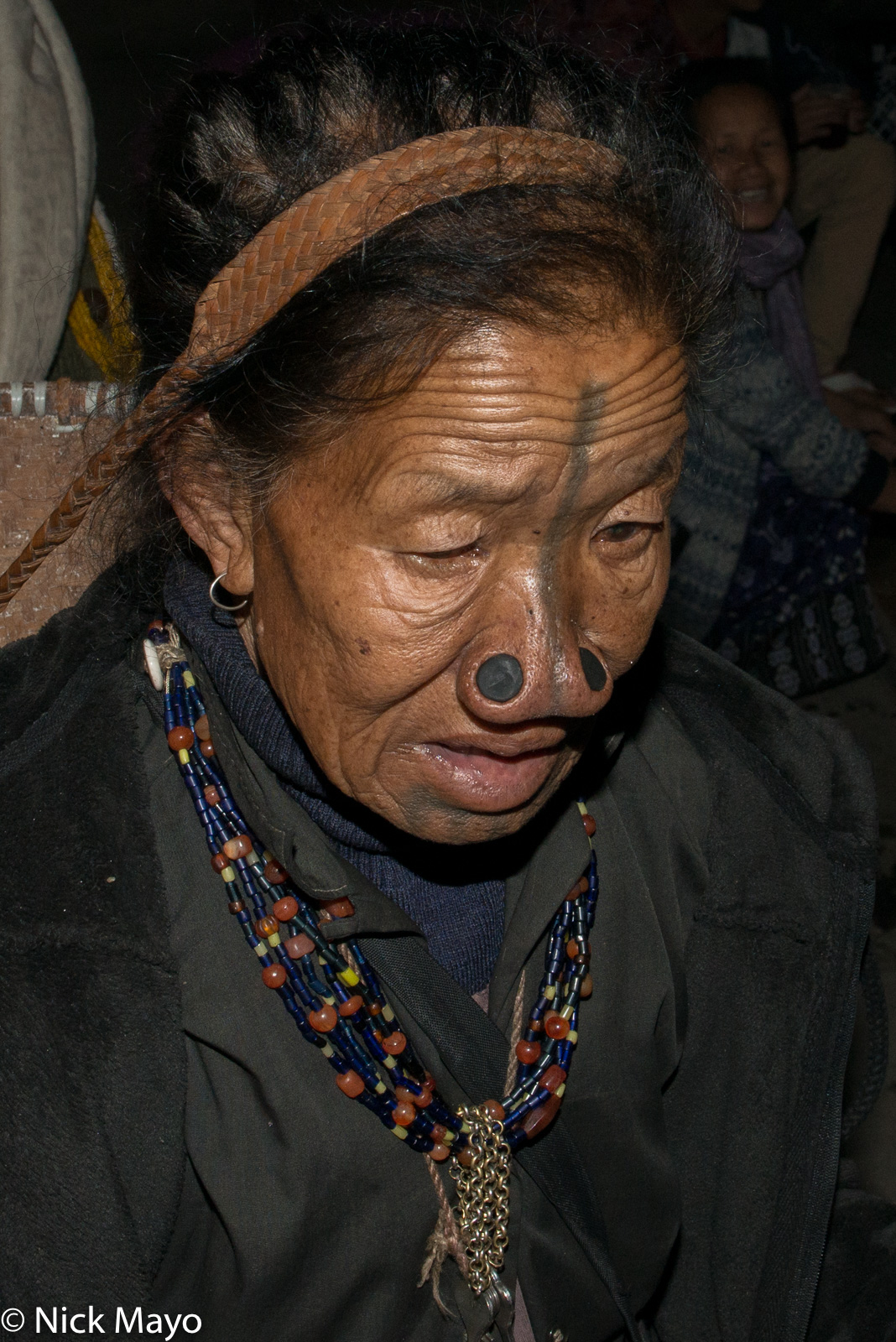 A tattooed Apatani women with nose plugs at the Myoko festival in Mudang Tage in the Ziro valley.