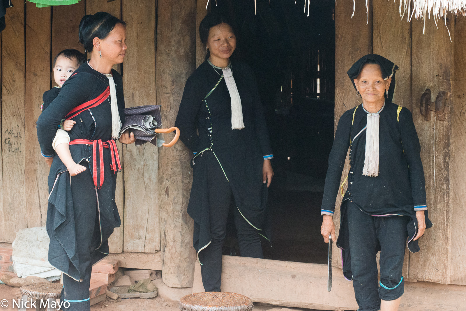 Three traditionally dressed Lantien Dao women in the Nam Ma valley.