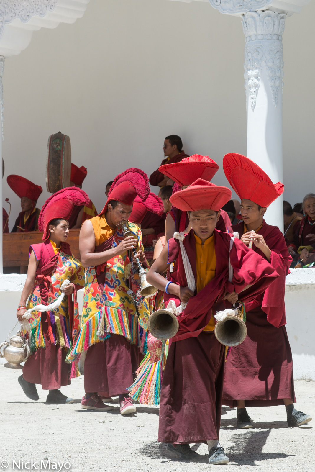 Monks playing horns followed by one carrying a censer at the annual Phyang Tserup.