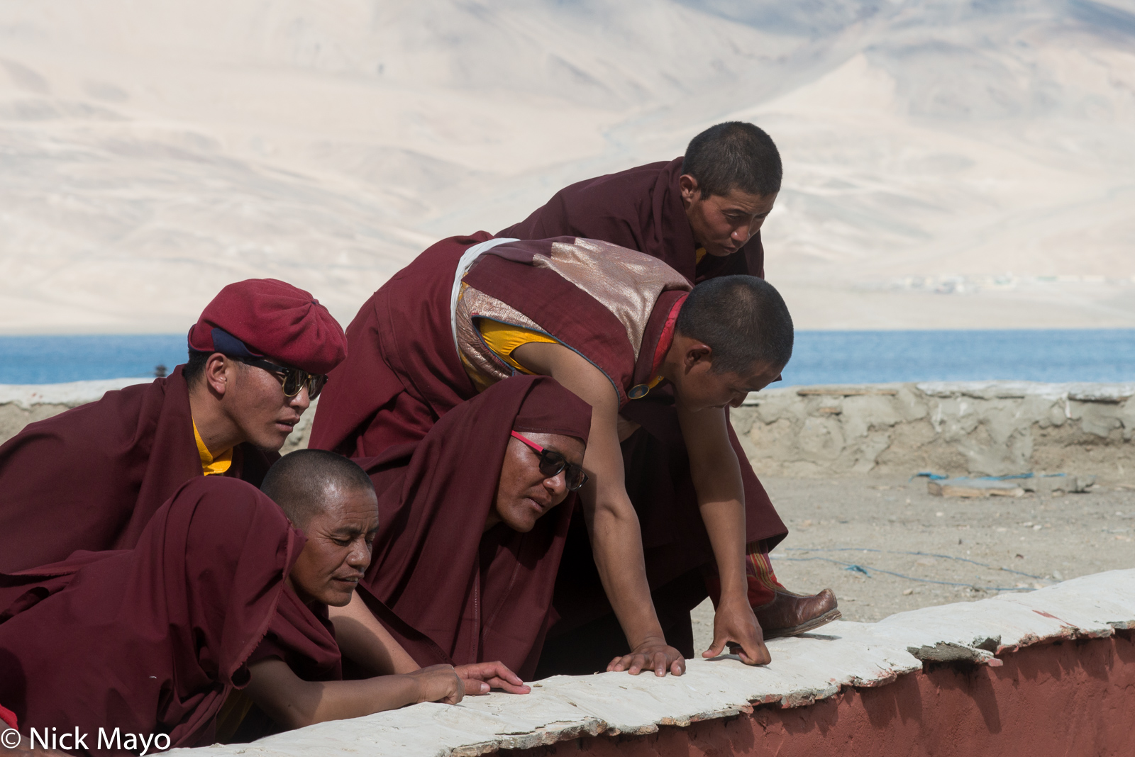 Changpa monks watching the dancing during the annual Korzok Gustor.