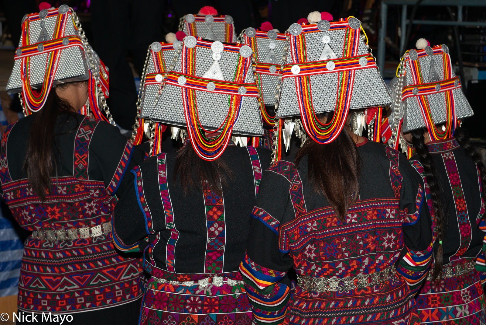 Pamee Akha (Hani) women watching a show at an Akha festival in Kengtung.