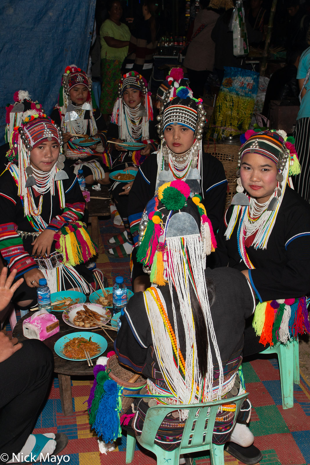 Young Akha (Hani) women having dinner at a festival in Kengtung.