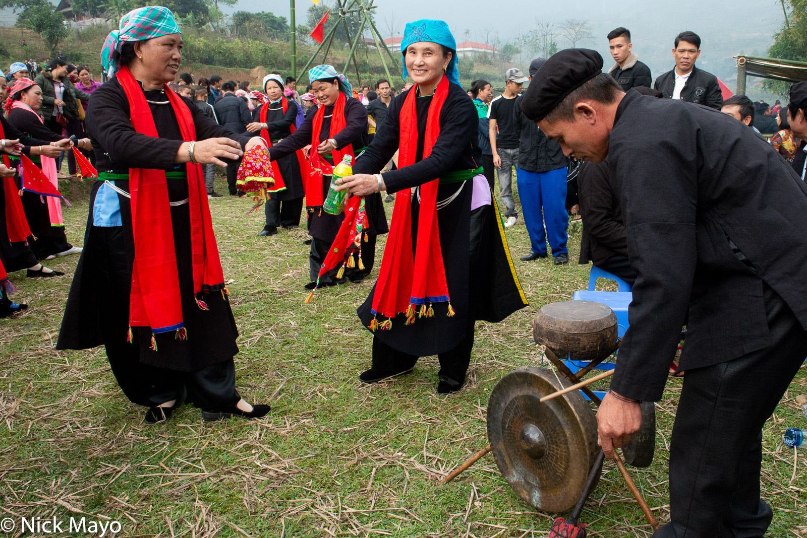 Tay (Zhuang) women dancing to a drum and gongs at a festival in Ban Ho in the Muong Hoa valley.