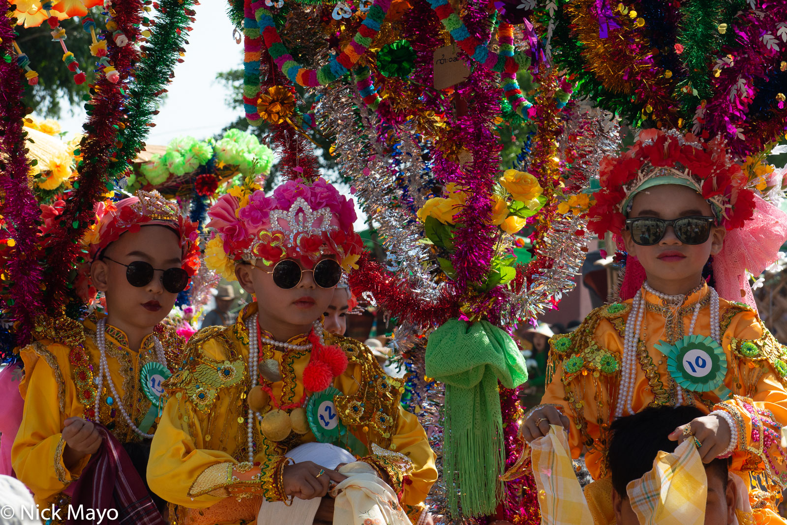 Novitiates in the shinlaung hle pwe (procession) at a shinbyu (novitiation ceremony) in the Shan village of Phan Khao.