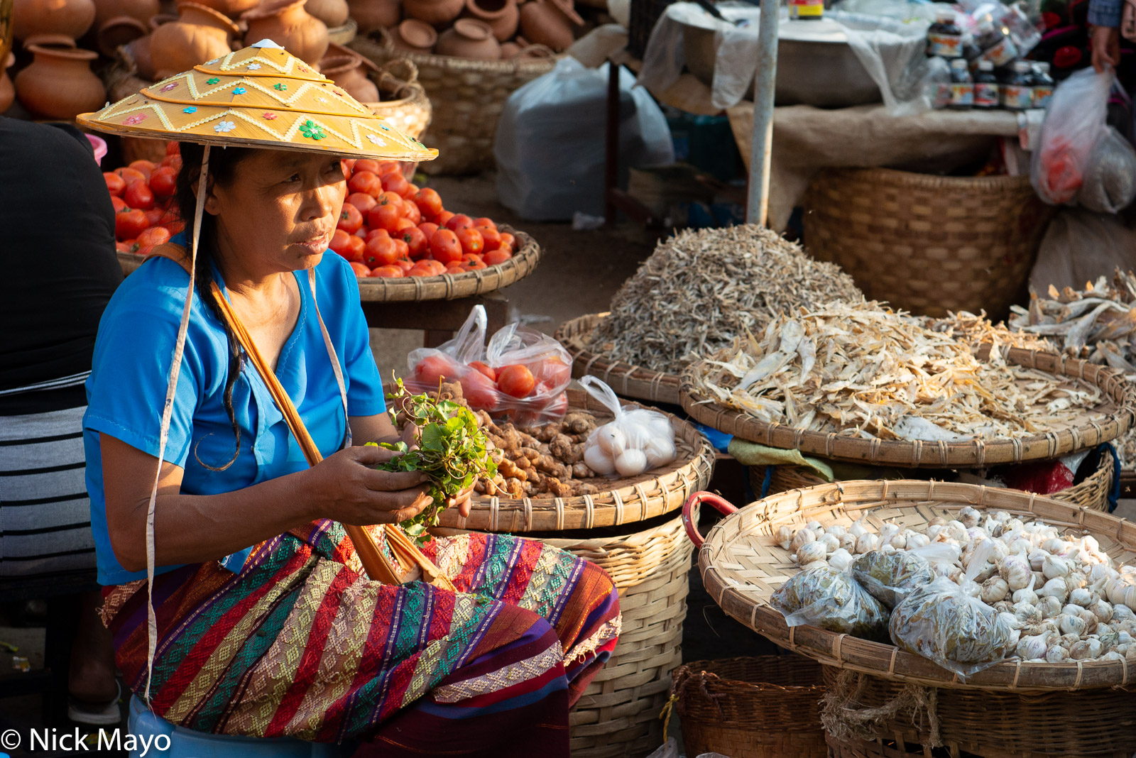 A Shan market vendor selling vegetables at Kyaukme.