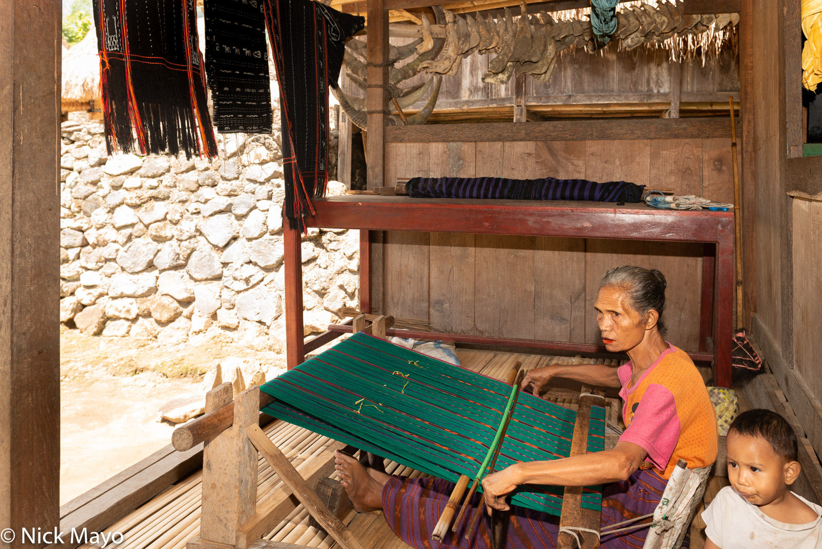 A woman weaving in the Ngada Regency village of Luba.