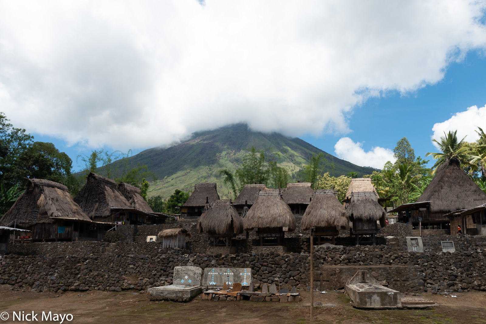 Graves and thatched roof bhaga in the Ngada Regency village of Luba.