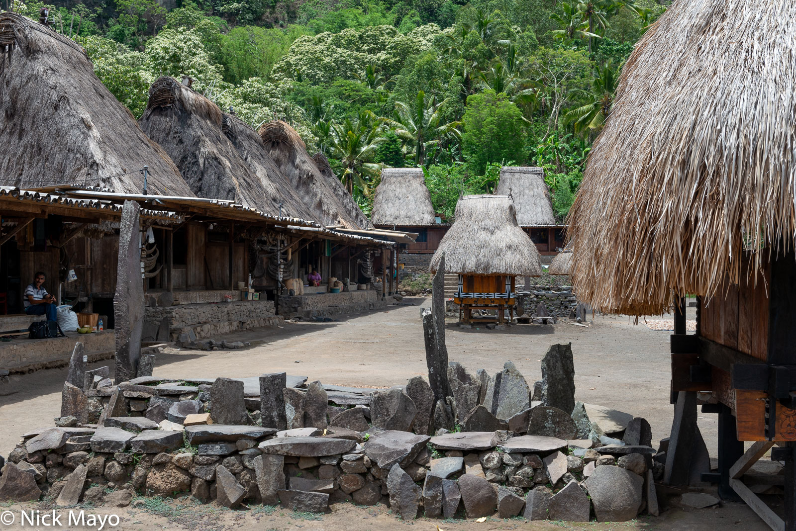 A watu lewa (stone altar) and bhaga in the thatched roof village of Tolelela in Ngada Regency.