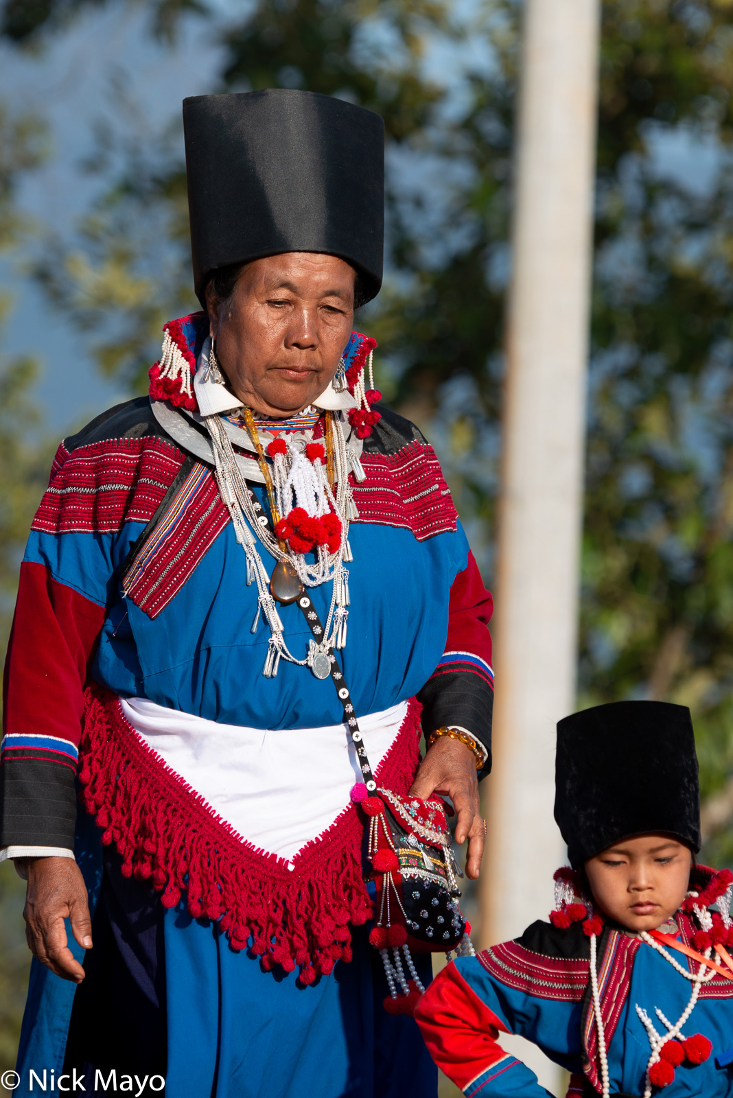 A traditionally dressed woman and child at a Lisu New Year festival in Mogok.