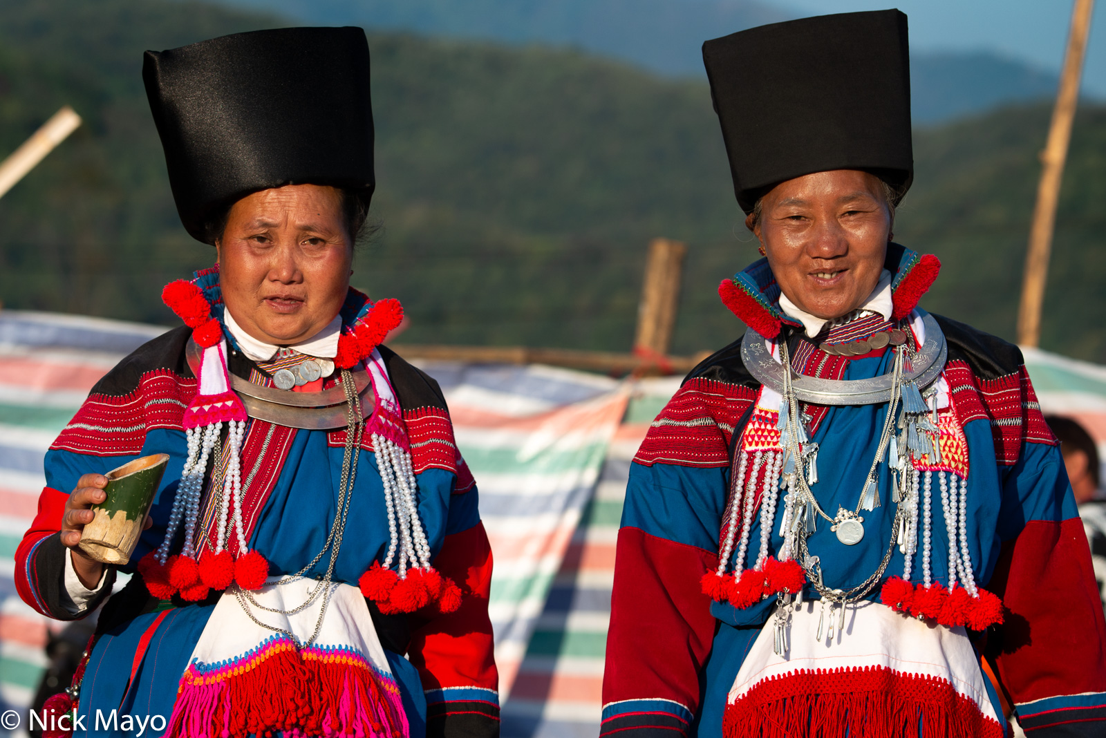 Two women in traditional Lisu dress at a Lisu New Year festival in Mogok.