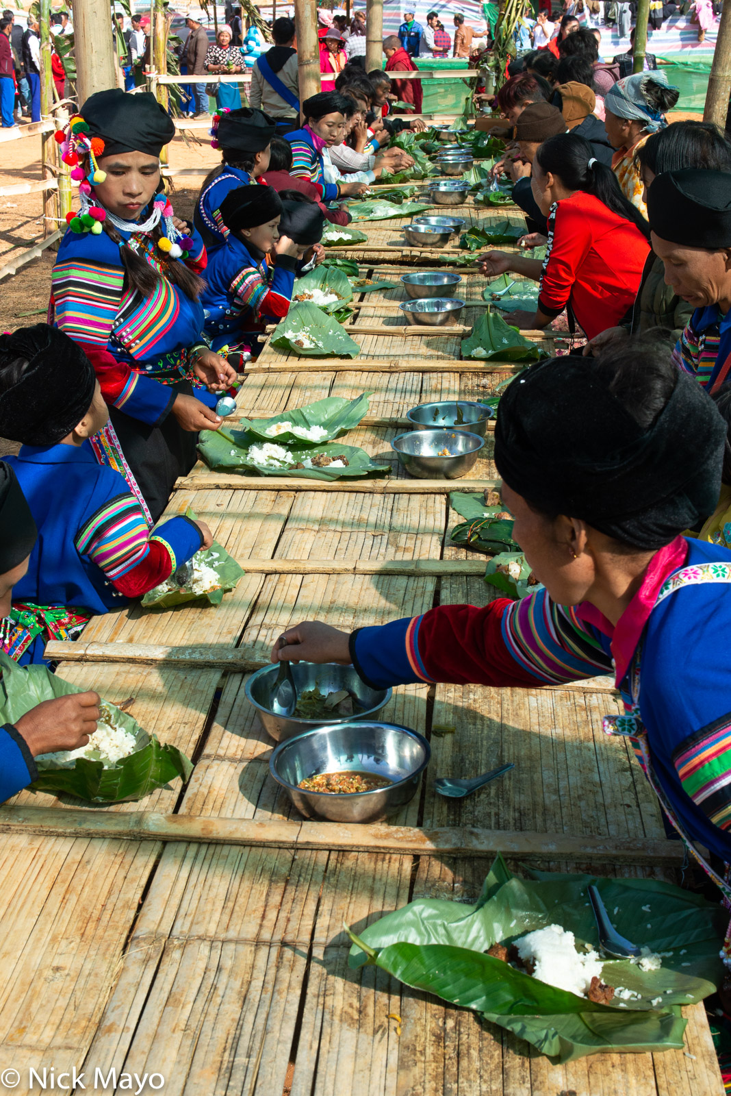 Lisu New Year festival attendees eating lunch  at their celebration in Mogok.