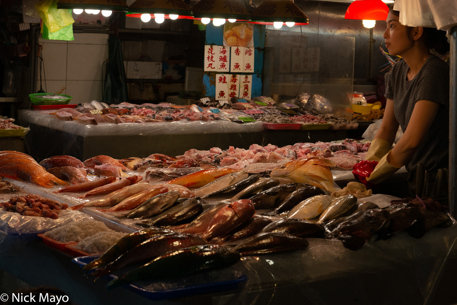 A woman selling fish at the seafood market in Donggang in Pingtung County.