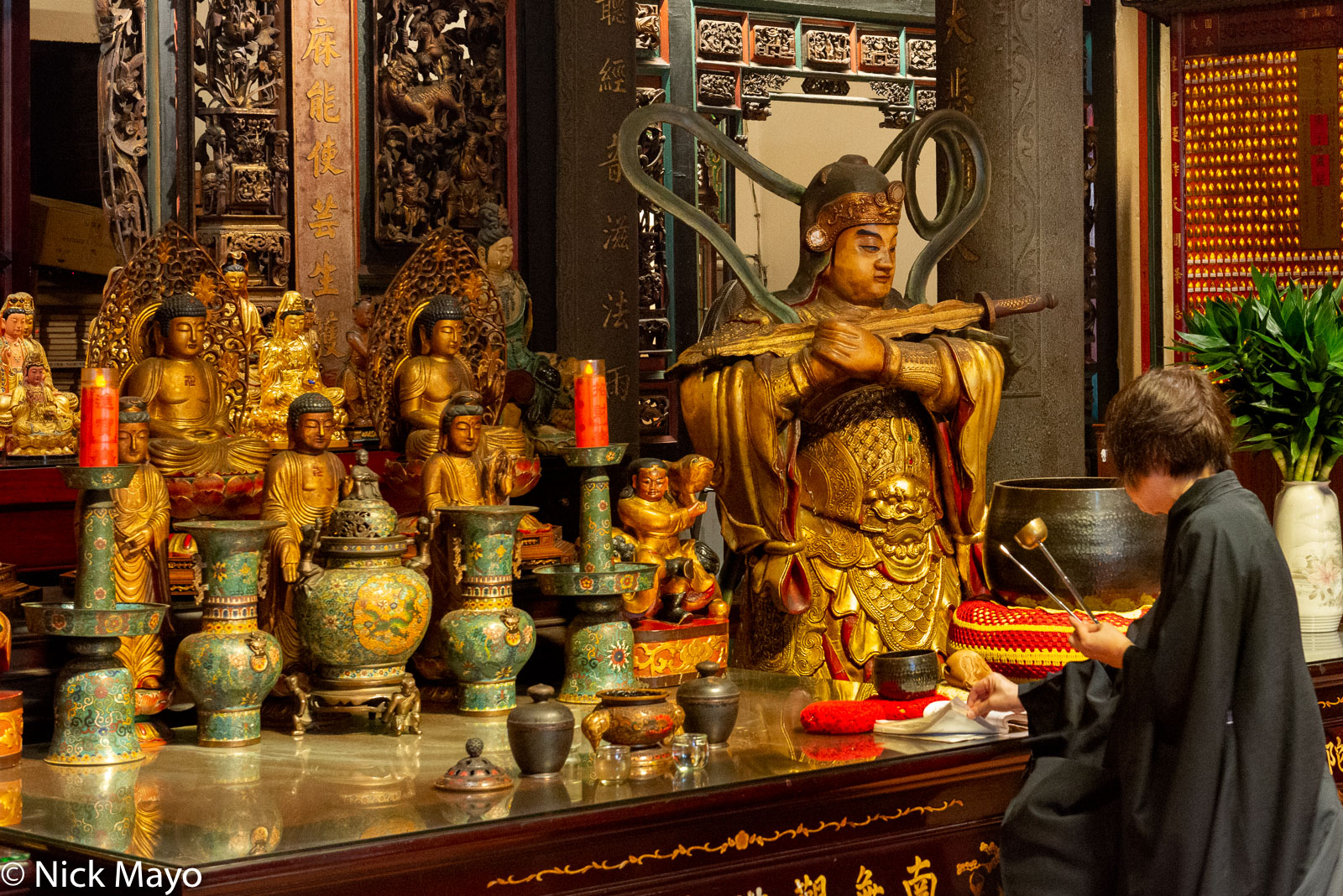 A worshipper performing bai bai at the Tamsui  Longshan temple built in 1858.